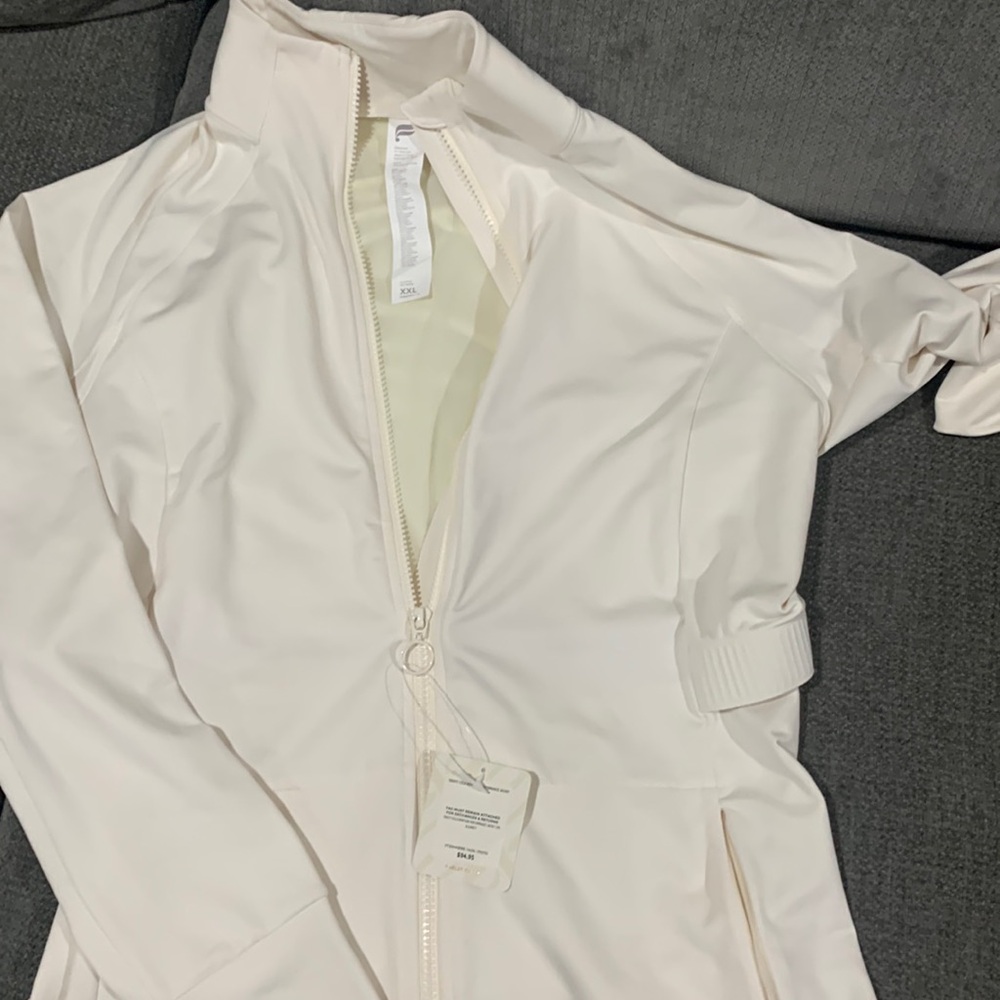 Fabletics women’s jacket cream side and back pockets for keys cellphone etc